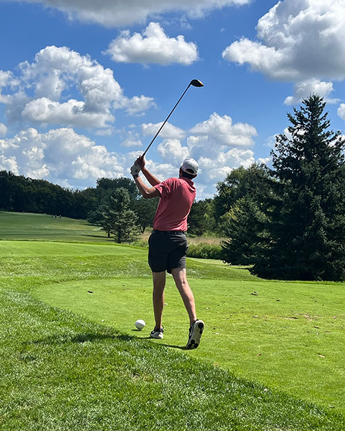 Golfer swinging